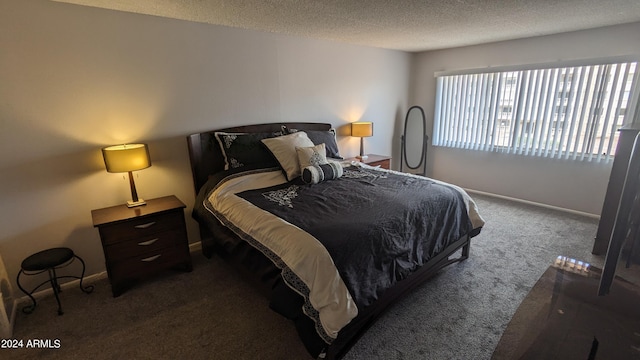 carpeted bedroom with a textured ceiling