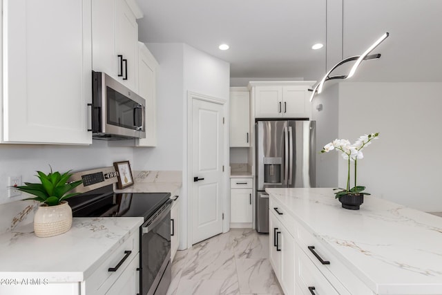 kitchen featuring recessed lighting, stainless steel appliances, white cabinetry, marble finish floor, and light stone countertops