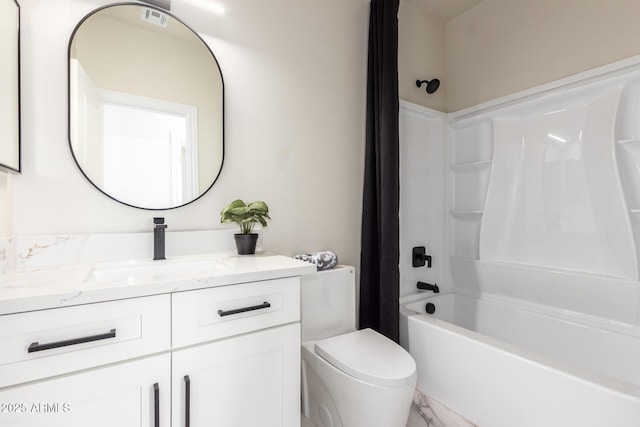 bathroom with toilet, shower / tub combo, and vanity