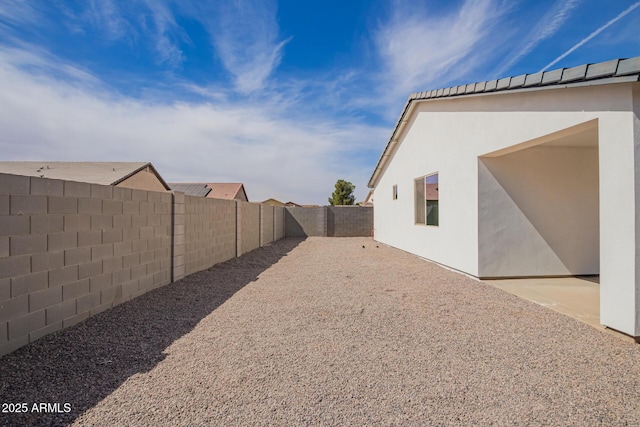 view of yard featuring a fenced backyard and a patio