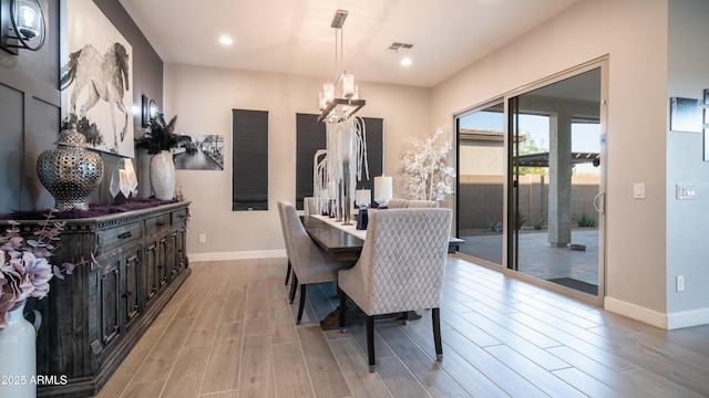 dining area with recessed lighting, wood finished floors, visible vents, and baseboards