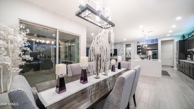 dining area featuring light wood-style floors and recessed lighting