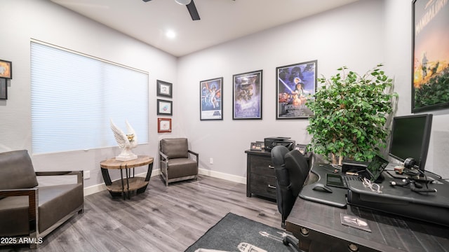 office space featuring ceiling fan, baseboards, and wood finished floors