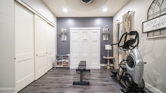 workout room with recessed lighting, wood finished floors, and baseboards