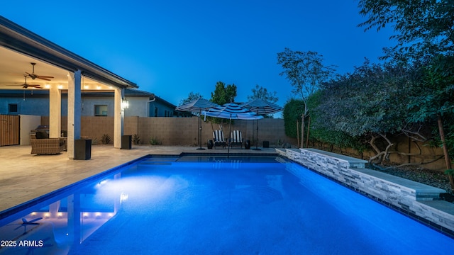 view of pool featuring a fenced backyard, a fenced in pool, and a patio