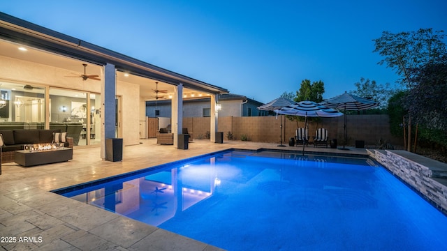 view of pool with a patio area, a fenced backyard, a ceiling fan, and a fenced in pool