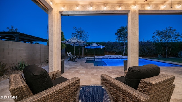 view of pool with a fenced in pool, a patio area, and a fenced backyard