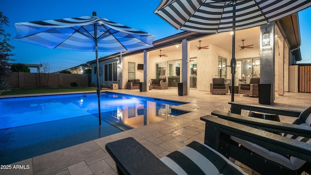 view of pool with a fenced in pool, ceiling fan, an outdoor hangout area, fence, and a patio area