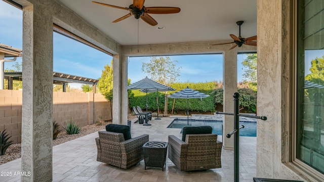 view of patio with a fenced backyard, ceiling fan, and a fenced in pool