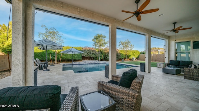 view of patio featuring a fenced in pool, a fenced backyard, and an outdoor living space