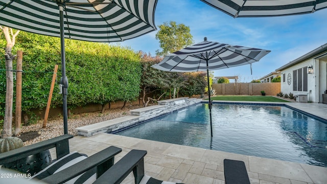 view of pool with a fenced in pool, a patio area, and a fenced backyard