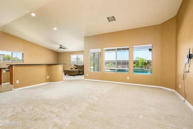 unfurnished living room with recessed lighting, light carpet, ceiling fan, baseboards, and visible vents