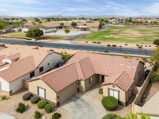 drone / aerial view featuring a mountain view and a residential view