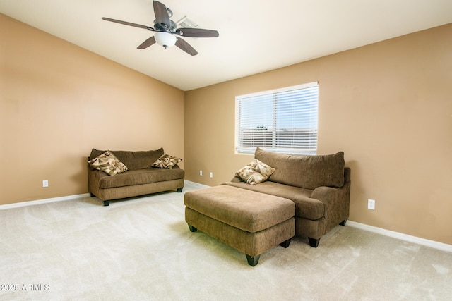 sitting room with carpet flooring, baseboards, ceiling fan, and lofted ceiling