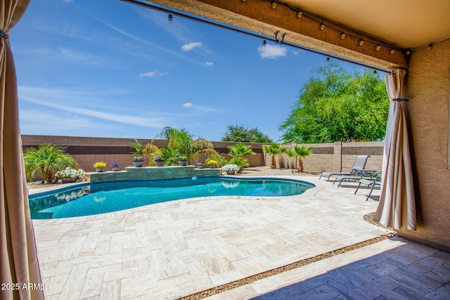view of pool with a fenced backyard, a fenced in pool, and a patio area
