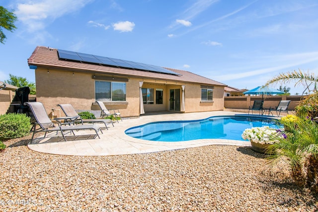 view of swimming pool with a fenced backyard, a fenced in pool, and a patio area