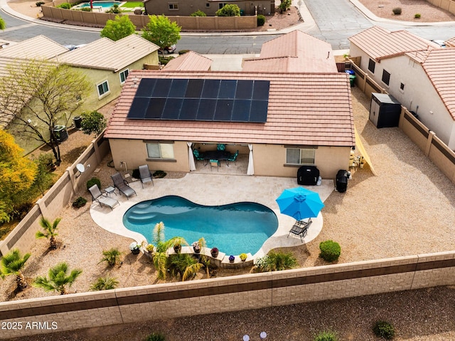 view of swimming pool featuring a patio, a fenced backyard, and a fenced in pool