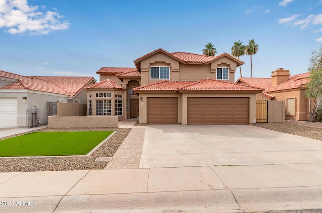 mediterranean / spanish-style house featuring a garage