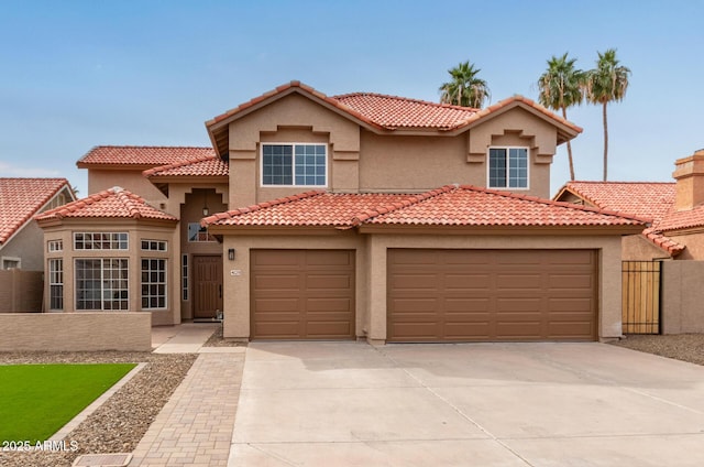 mediterranean / spanish house featuring a garage