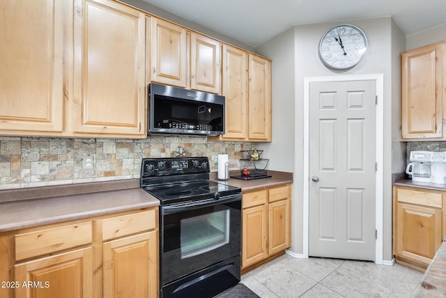 kitchen with tasteful backsplash, stainless steel microwave, black / electric stove, light countertops, and light brown cabinets