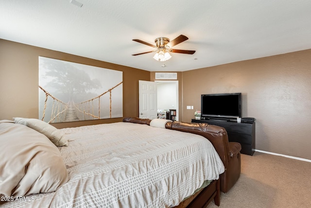 bedroom featuring ceiling fan, carpet floors, and baseboards