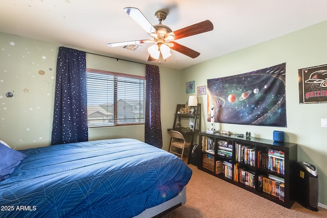 carpeted bedroom with a ceiling fan and visible vents