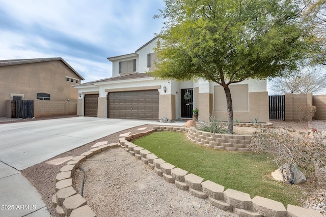 view of front facade featuring a gate, driveway, fence, and stucco siding