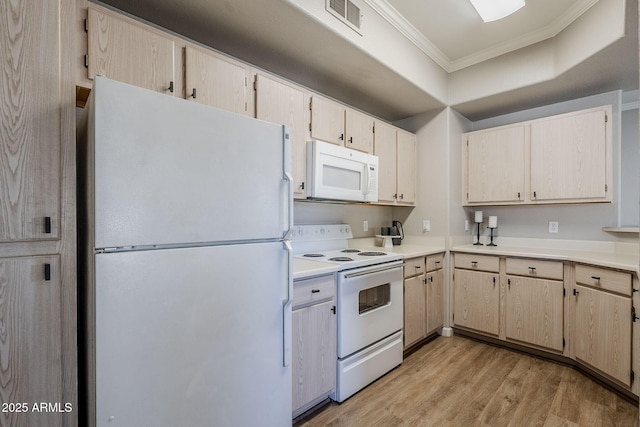 kitchen with light countertops, light wood-style flooring, visible vents, white appliances, and ornamental molding