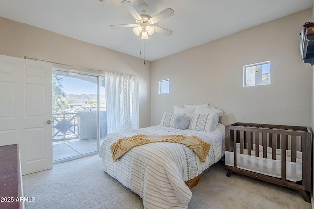 bedroom featuring access to exterior, carpet, and a ceiling fan