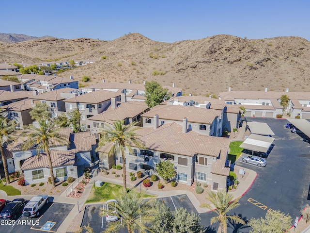 birds eye view of property with a residential view and a mountain view