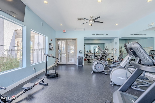 gym featuring a wealth of natural light, baseboards, ceiling fan, and visible vents