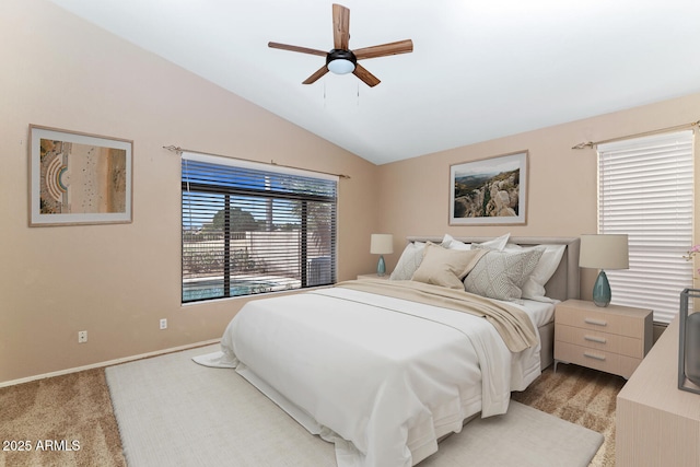 bedroom featuring vaulted ceiling, a ceiling fan, and baseboards