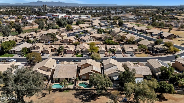 birds eye view of property with a residential view and a mountain view