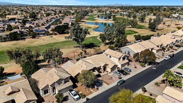 bird's eye view with a water view, a residential view, and golf course view