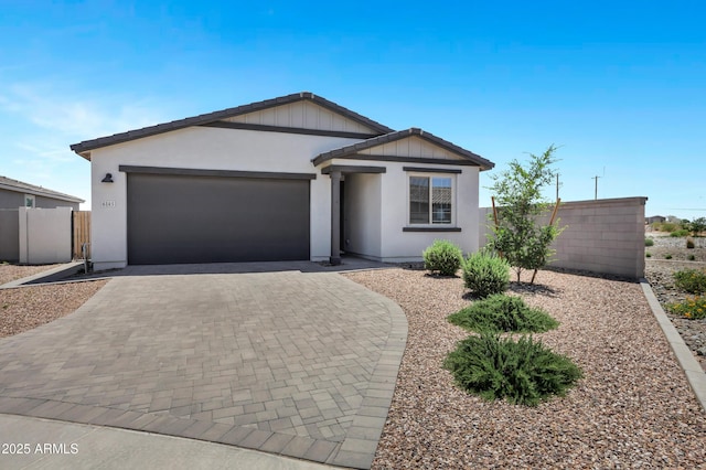 6145 S Adelle, Mesa, AZ 85212 - ranch-style house with an attached garage, decorative driveway, and stucco siding