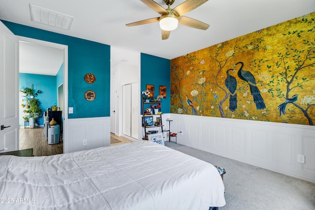 6145 S Adelle, Mesa, AZ 85212 - bedroom featuring a wainscoted wall, ceiling fan, and a decorative wall