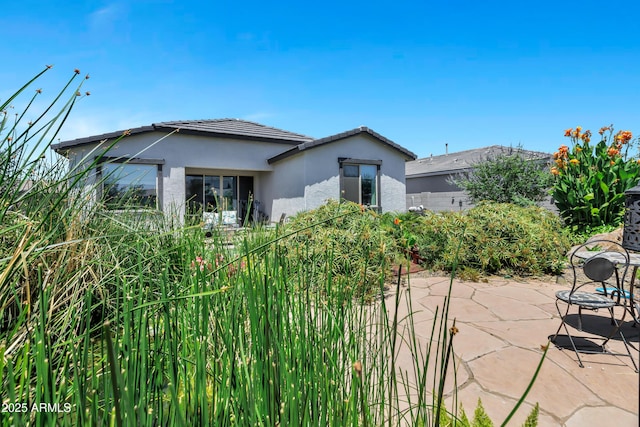 6145 S Adelle, Mesa, AZ 85212 - back of house with a patio area, stucco siding, and a tiled roof