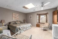 bedroom featuring a skylight