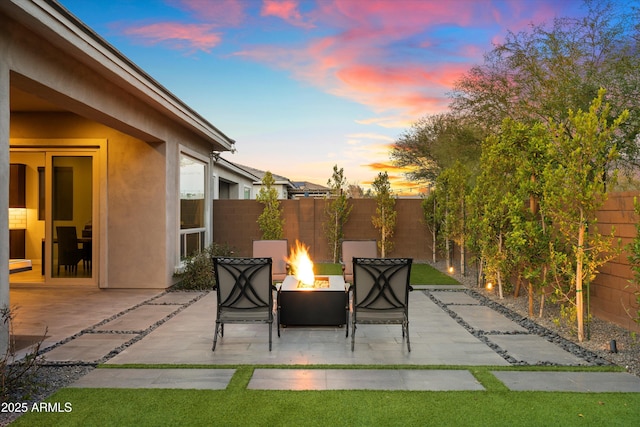 view of patio with a fire pit and a fenced backyard