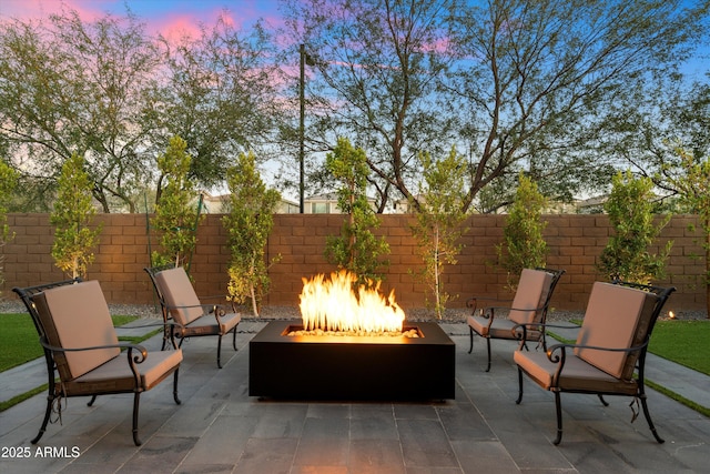 view of patio / terrace featuring a fire pit