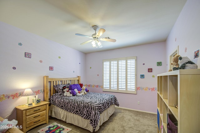 carpeted bedroom featuring baseboards and a ceiling fan
