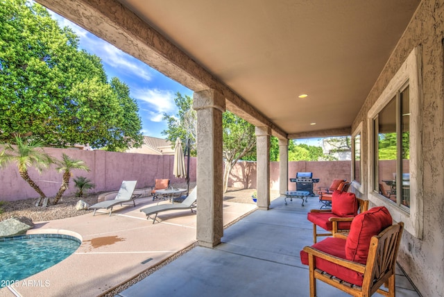 view of patio with a fenced in pool and a fenced backyard