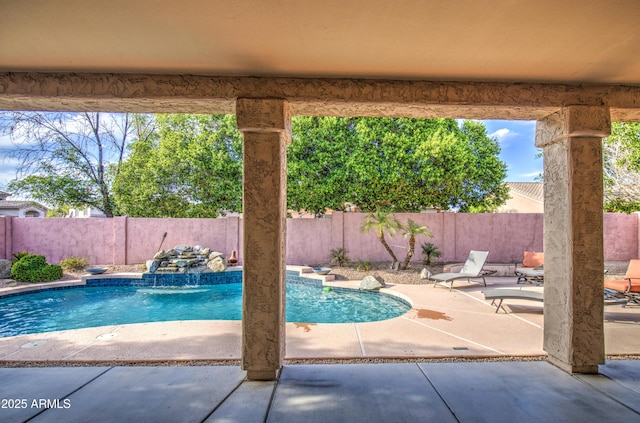 view of swimming pool with a fenced in pool, a fenced backyard, and a patio