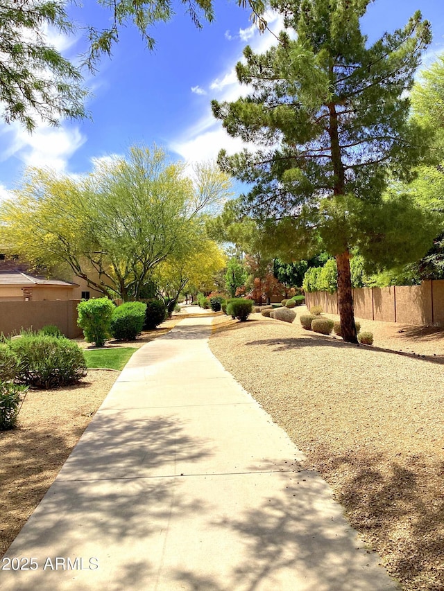 view of property's community with fence