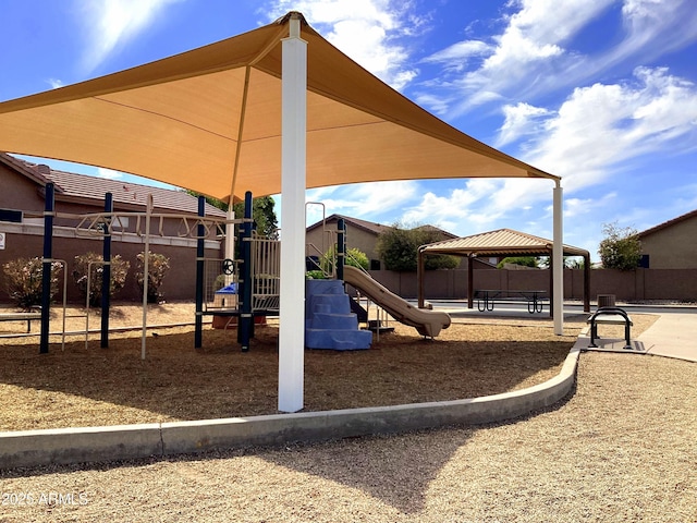 community play area with fence and a gazebo