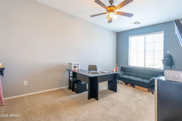 office area featuring light carpet and ceiling fan