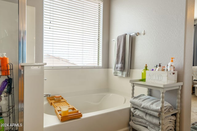 bathroom featuring a bath