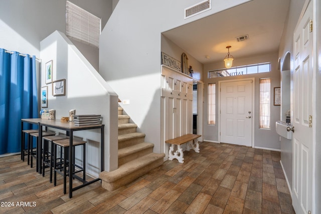 entrance foyer with dark hardwood / wood-style floors