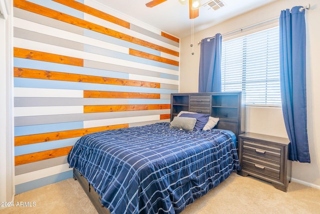 bedroom featuring light carpet and ceiling fan