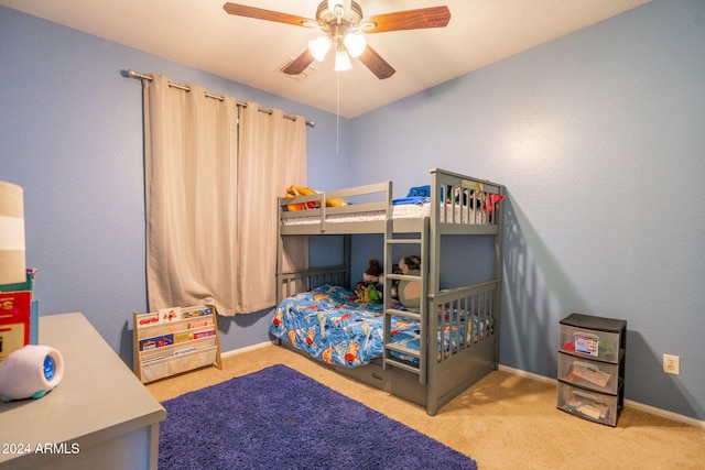 bedroom with light carpet and ceiling fan